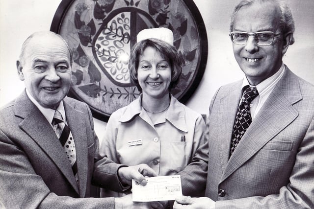 A cheque for £252 was presented to Mr Jack Hurst, Administrative Director of St Luke's Hospice (right) from Mr Alan Hewitt, Concert Administrator of the Christmas Music and Carols by King Edward VII School Choirs Concert organised to raise funds for the St. Luke's Nursing Home.  Also pictured is Mrs Diana Plumtree, Assistant to the Matron