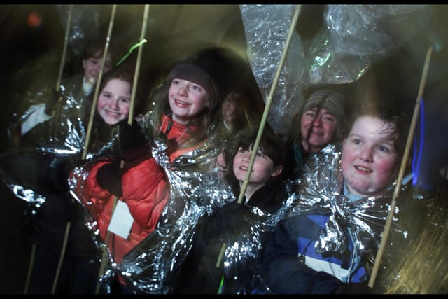 Some of the Glasgow schools children who took part in the Parade of Stars, wrapped up against the sleet and snow,  prior to the firework display at Glasgow Science Centre, heralding in 2001.