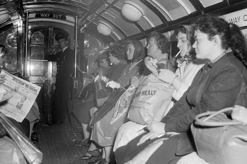 A look inside a Glasgow Subway carriage in 1962 as people head to their various destinations with some having partaken in some retail therapy. 