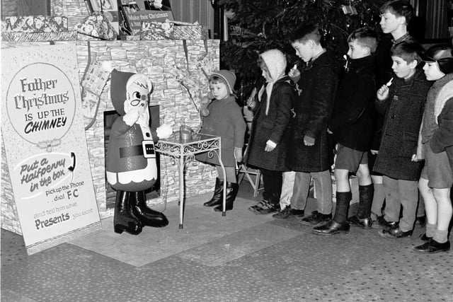 Maureen Lusher talks to Santa Claus on a special Santa Phone at the Odeon cinema in 1965.