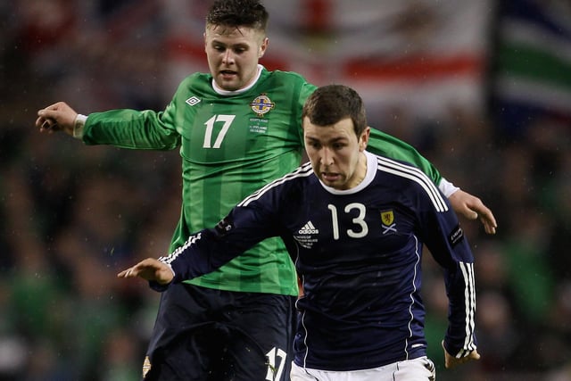 James McArthur of Scotland (R) in action with Oliver Norwood of Northern Ireland during the Carling Nations Cup match in Dublin