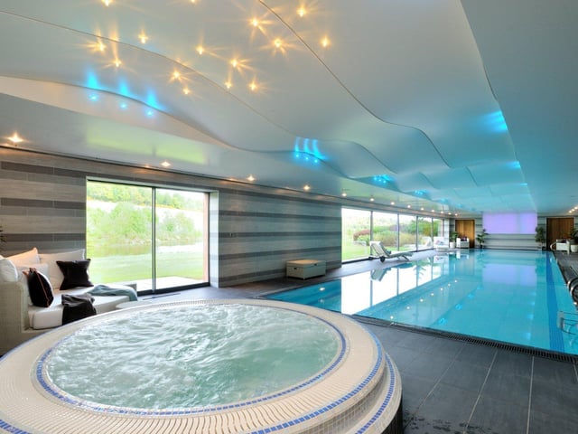 Below the main living spaces is an additional floor of leisure facilities including a generously sized swimming pool, complete with a Jacuzzi and sauna.