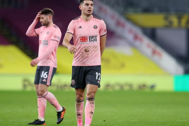 John Egan of Sheffield United looks dejected at the final whistle during the Premier League match at Turf Moor, Burnley. Picture date: 29th December 2020. Picture credit should read: Simon Bellis/Sportimage