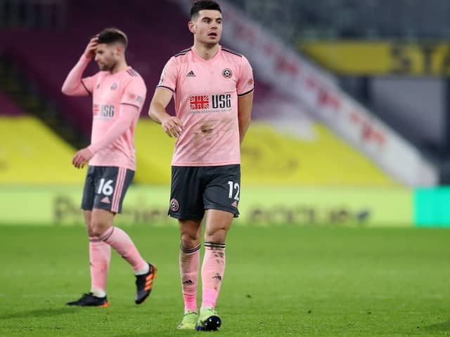 John Egan of Sheffield United looks dejected at the final whistle during the Premier League match at Turf Moor, Burnley. Picture date: 29th December 2020. Picture credit should read: Simon Bellis/Sportimage