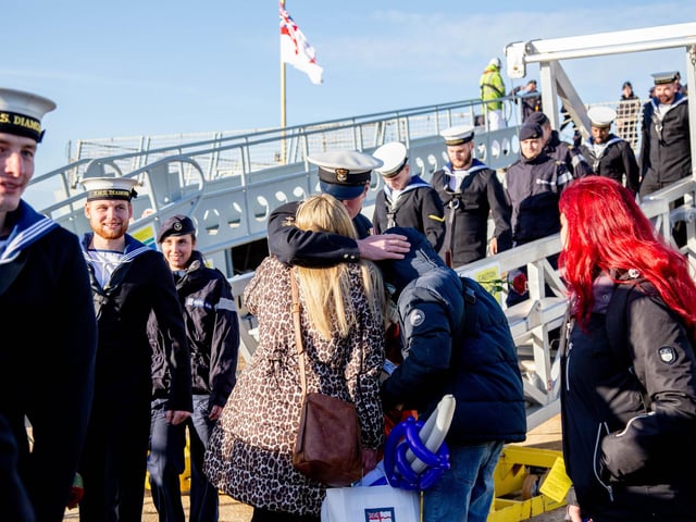 Crew members embrace family as they step off HMS Diamond. Picture: Habibur Rahman