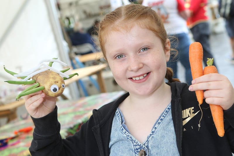 Youngsters could have a go at creating vegetable sculptures. Pictured is Poppy Jones, aged 10, with her creation.