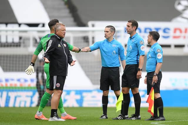 Chris Wilder speaks to the referee after Sunday's defeat to Newcastle United.