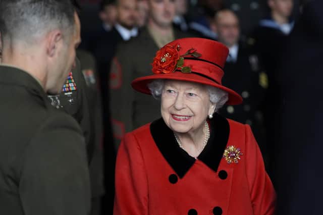 Queen Elizabeth II talks to military personnel during a visit to HMS Queen Elizabeth at HM Naval Base, Portsmouth, ahead of the ship's maiden deployment. The visit comes as HMS Queen Elizabeth prepares to lead the UK Carrier Strike Group on a 28-week operational deployment travelling over 26,000 nautical miles from the Mediterranean to the Philippine Sea. Picture: Steve Parsons/PA Wire