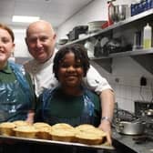 A group of six pupils from Woodlands Primary School, in Norton, were handed work with the Blend Kitchen ‘Gather and Cook’ programme, a five-week culinary education scheme, as an alternative to sitting the year six exams, because of their special needs.. Ellie  and Edith with chef John Forrest