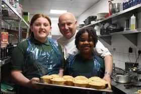 A group of six pupils from Woodlands Primary School, in Norton, were handed work with the Blend Kitchen ‘Gather and Cook’ programme, a five-week culinary education scheme, as an alternative to sitting the year six exams, because of their special needs.. Ellie  and Edith with chef John Forrest
