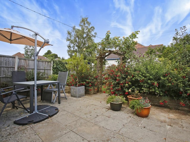 The patio area can be accessed via French doors from the kitchen