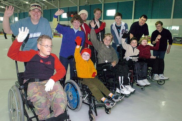 Young wheelchair users on the ice at iceSheffield. They are, left to right, Andrew Bott, Michael Wing, James Parkin, Thomas Parkin and Zoe Smith July 7, 2004
