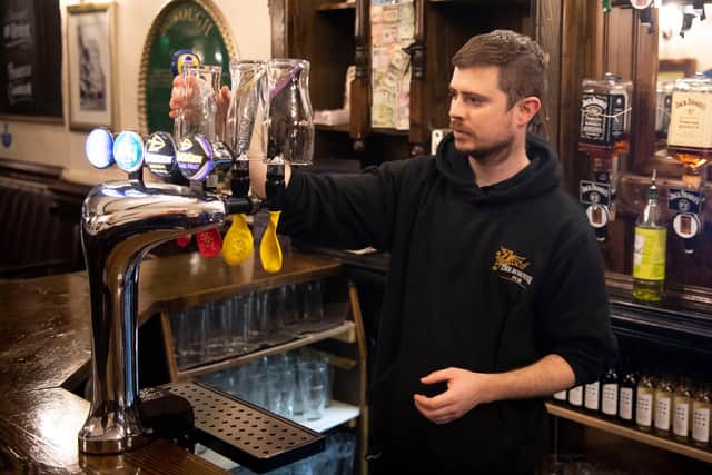 CARDIFF, WALES - DECEMBER 04: A worker covers up beer taps in the Borough pub on December 4, 2020 in Cardiff, Wales. Following a firebreak period that ran from October 23 to November 9 the Welsh Government have introduced new rules which will prevent pubs, restaurants and cafes from selling alcohol at any time from 6pm on Friday. The rules will be reviewed on December 17. (Photo by Matthew Horwood/Getty Images)