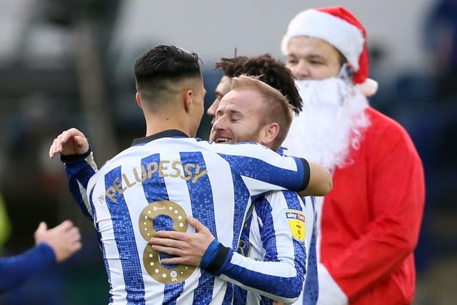 Santa 'photo bombs' Joey Pelupessy and Barry Bannan celebrating Wednesday's win over Bristol City last Christmas.