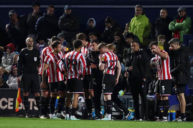 Paul Heckingbottom speaks to Sheffield United's team during the match at Loftus Road: Warren Little/Getty Images