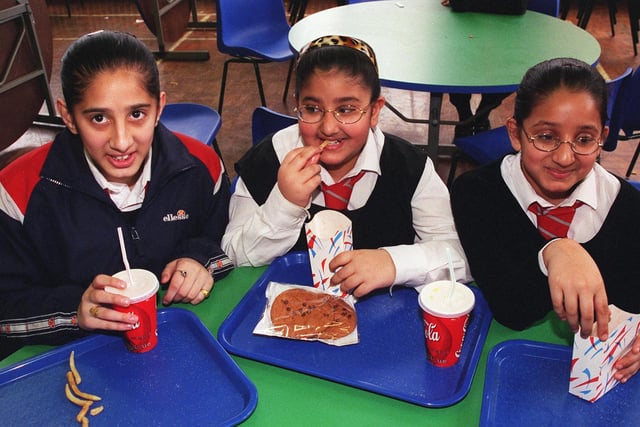 New dinners on the menuat Kimberworth Comp in 2000 and pictured are the Hussain sisters, they are, left to right, Zainab, 13, Halima, 11 and Zeenat, 12.