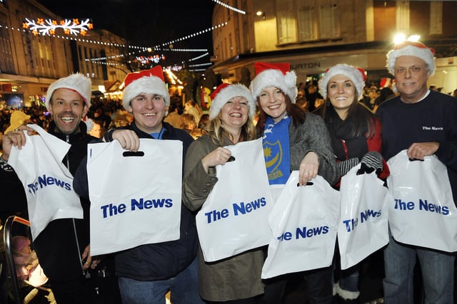 The News sellers and promotions team with their goodie bags, enjoying the Christmas lights show in Commercial Road, Portsmouth in 2008.
Festive switch-on of the City Centre Christmas Lights in Commercial Road, outside Debenhams near the Jubilee Fountain and inside the Cascades Shopping Centre. 
Picture: Michael Scaddan (084638-0288)