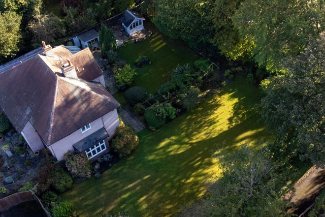 Externally the property is set on a generous mature garden extending to a circa 0.35 acres plot boasting an array of plants, trees, shrubs in addition to a paved patio, summerhouse and large lawned garden.