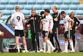 Chris Wilder, manager of Sheffield United, gives his team instructions during a drinks break at Villa Park   (Photo by Paul Ellis/Pool via Getty Images)