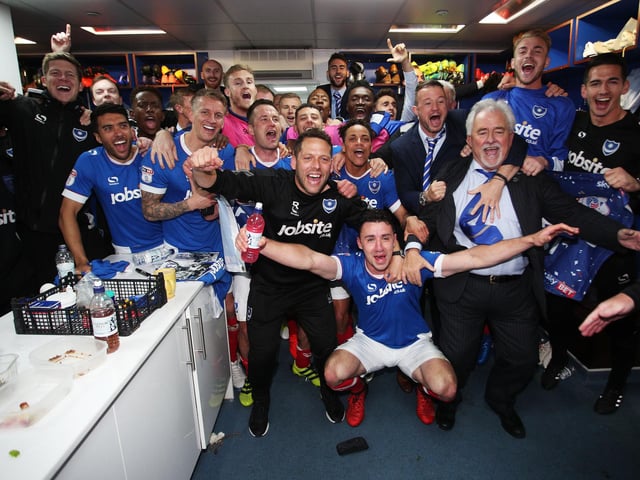 The players toast the success in the dressing room.