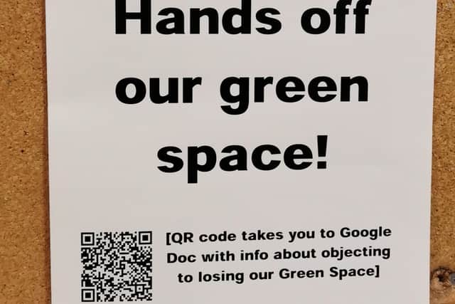 A protest poster by a group of residents of Park Hill flats who are opposing a bid by Urban Splash to turn green space into car parking for the development of the former Sheffield City Council estate. Picture: Julia Armstrong, LDRS