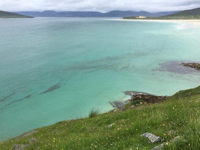“The first view of the beach once though the dunes always takes my breath away. Even in peak season, we are often the only people here. The surf rushes in even on the calmest of days and the light playing over the North Harris hills in the far distance is gorgeous.”