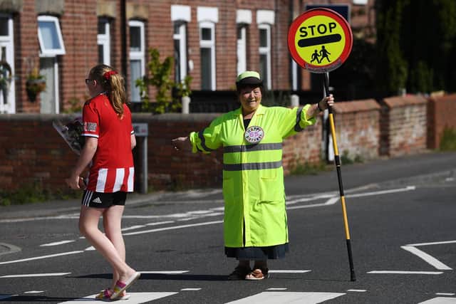 Treeton Lollypop lady, Glynnis Bolton, who has done the job for 20 years. Celebrates her 65th today.
Picture Jonathan Gawthorpe
24th April 2020.