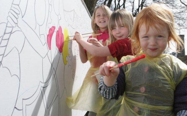 Eva French, Freida Gilliat, Lola French paint a mural at Heights of Abraham in Matlock Bath in 2010.