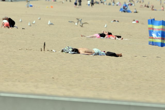 Prime Minister Boris Johnson told the public they could sunbathe in public spaces providing they socially distanced.