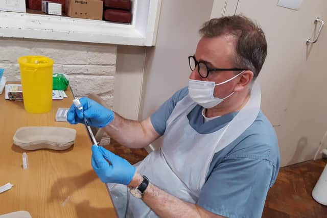 A Sheffield GP prepares a vaccine. GP practices are seeing staff absence rise as Covid cases increase, two years after the first lockdown was announced
