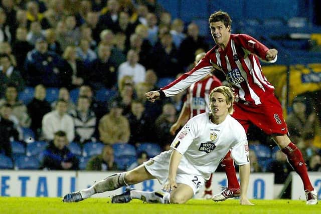Future Blade Matthew Kilgallon can only watch on as Andy Gray scores his second goal against Leeds, on this day in 2005: Gareth Copley/PA