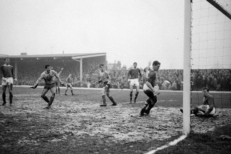 Stags pair Bill Curry and Harry Middleton in action against Bristol City in the Field Mill mud.