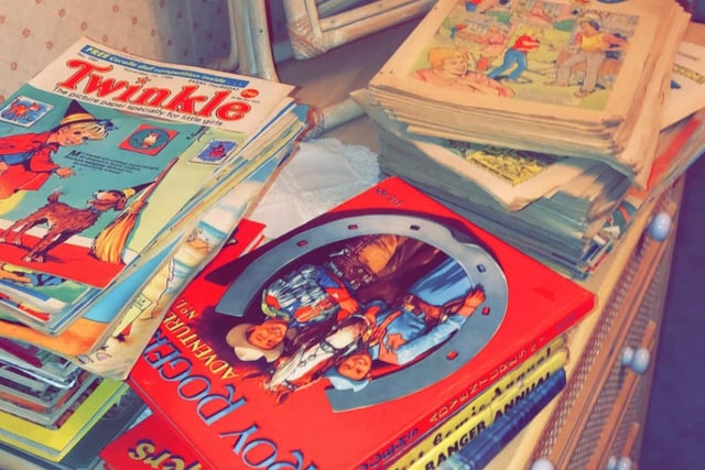 Piles of comic books dating back to the 90s/80s.