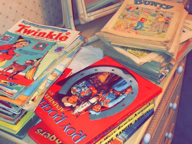 Piles of comic books dating back to the 90s/80s.
