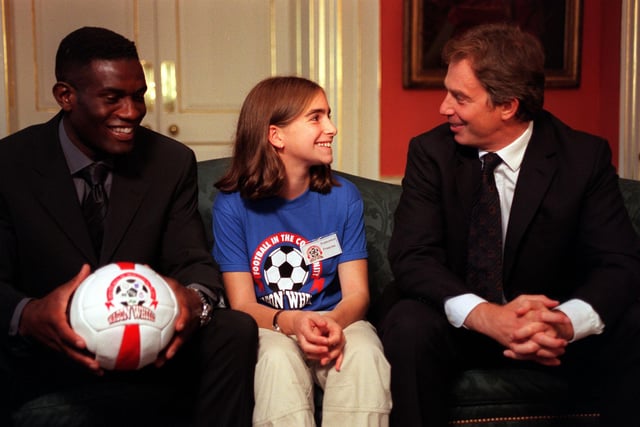 Prime Minister Tony Blair (right) and Wimbledon Football Club midfielder Robbie Earl with 11-year-old Francesca Franscina, representing Sheffield United FC at 10 Downing  Street in October 1999 as part of the national Football in the Community scheme