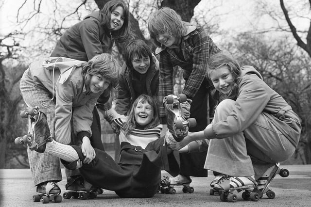 Ann Juler, 11, is helped by her classmates who were taking part in a skating marathon which was among the many events taking place at Southmoor School over one weekend in April 1975.