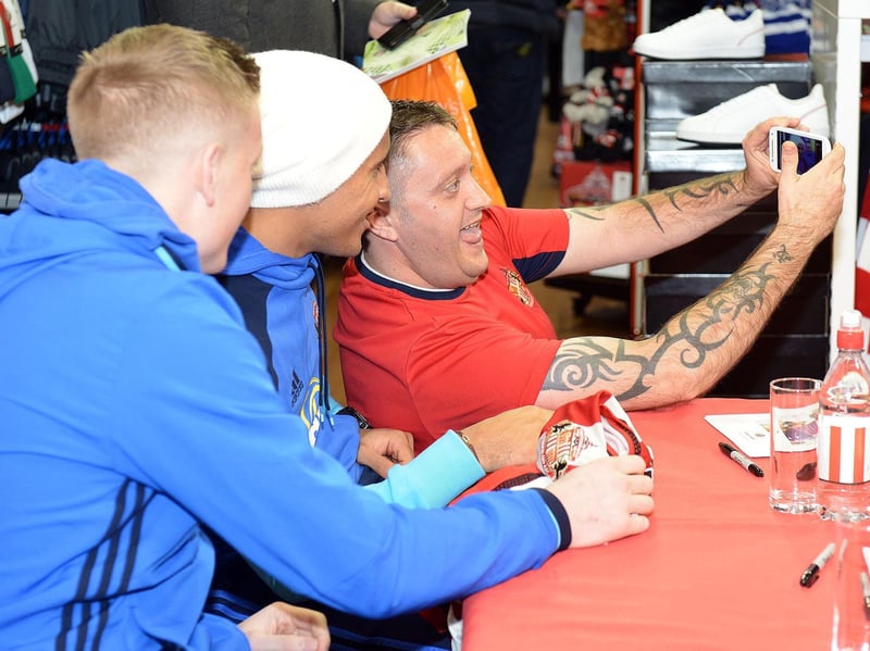 Jordan Pickford and Wahbi Khazri pose for a selfie with a fan in 2016.