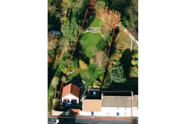 Aerial view showing house and grounds.