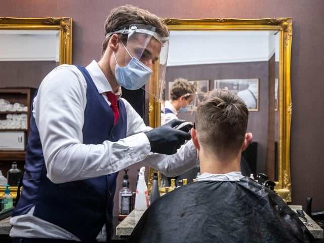 When lockdown was put in place it dawned on people that they wouldn't be able to get a professional haircut - some have attempted a home cut, while others are waiting it out until salons reopen. It is thought barbers and hairdressers may be able to go back to work in July; the picture is from the Czech Republic, which suggests what the experience might be like in England.