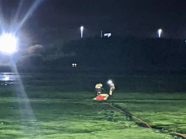 Two crew members had to wade more than 200m through the thick mud