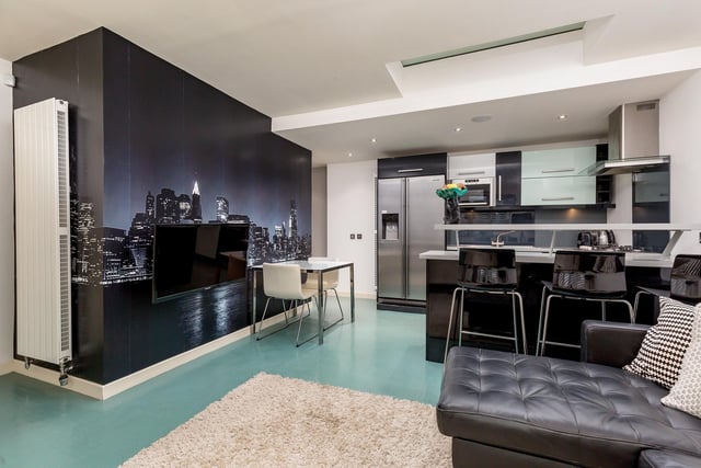 Living area with New York city skyline feature wall.