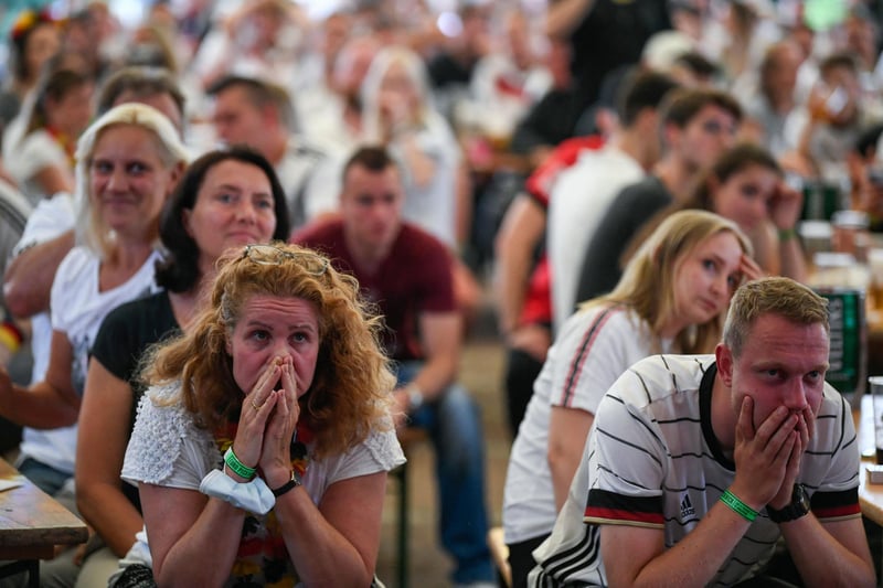 Germany supporters looked gloomy in Essen, western Germany, after England scored their second goal (AFP via Getty Images)