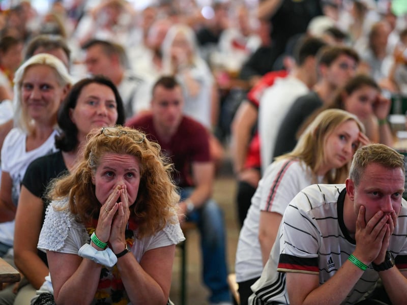 Germany supporters looked gloomy in Essen, western Germany, after England scored their second goal (AFP via Getty Images)