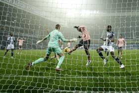 Sheffield United's Lys Mousset kicks his shot at goal over the crossbar during the closing stages of tyhe Premier League match at West Bromwich Albion: Andrew Boyers/Pool via AP