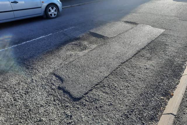System of potholes and furrows due to failing surface and patches on Greystones Road, which was resurfaced in 2014, create a dangerous hazard for cyclists on a steep hill.