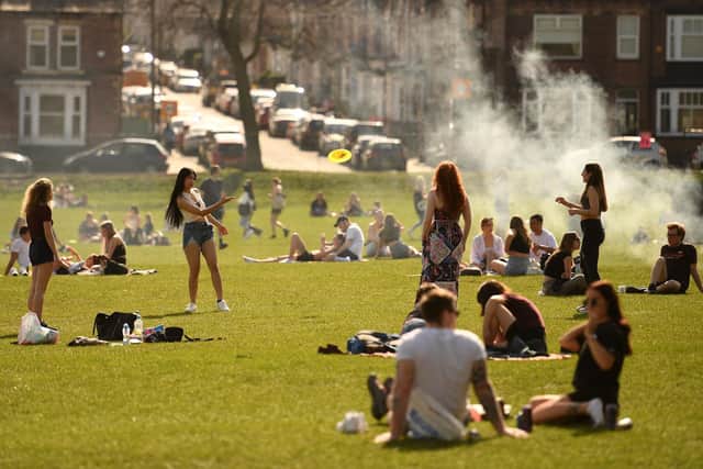 People enjoy the sunshine in Endcliffe Park in Sheffield (Photo by Oli SCARFF / AFP) (Photo by OLI SCARFF/AFP via Getty Images)