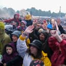 The huge Tramlines crowd enjoys the music of the 2023 Tramlines festival in Hillsborough Park, as the rain comes down. Picture: Dean Atkins, National World