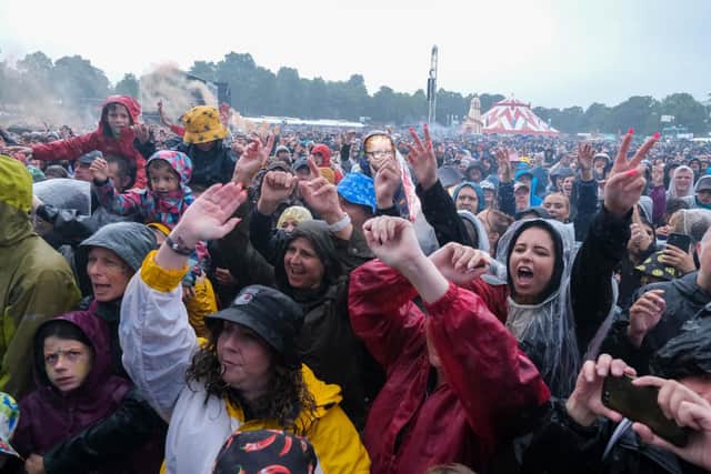 The huge Tramlines crowd enjoys the music of the 2023 Tramlines festival in Hillsborough Park, as the rain comes down. PIcture: Dean Atkins, National World