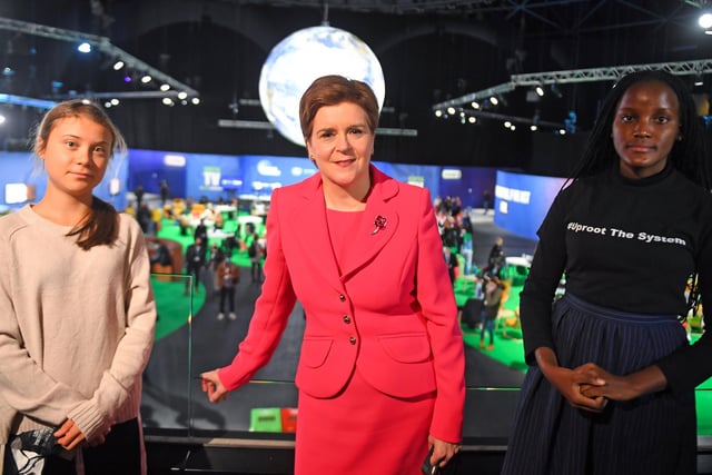 First Minister Nicola Sturgeon (centre) poses for a photograph during her meeting with climate activists Vanessa Nakate (right) and Greta Thunberg (left) during COP26.