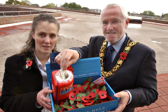 Mayor Bill Stephenson buys the first poppy from Royal British Legion stewardess Michelle Hamblett in 2005.